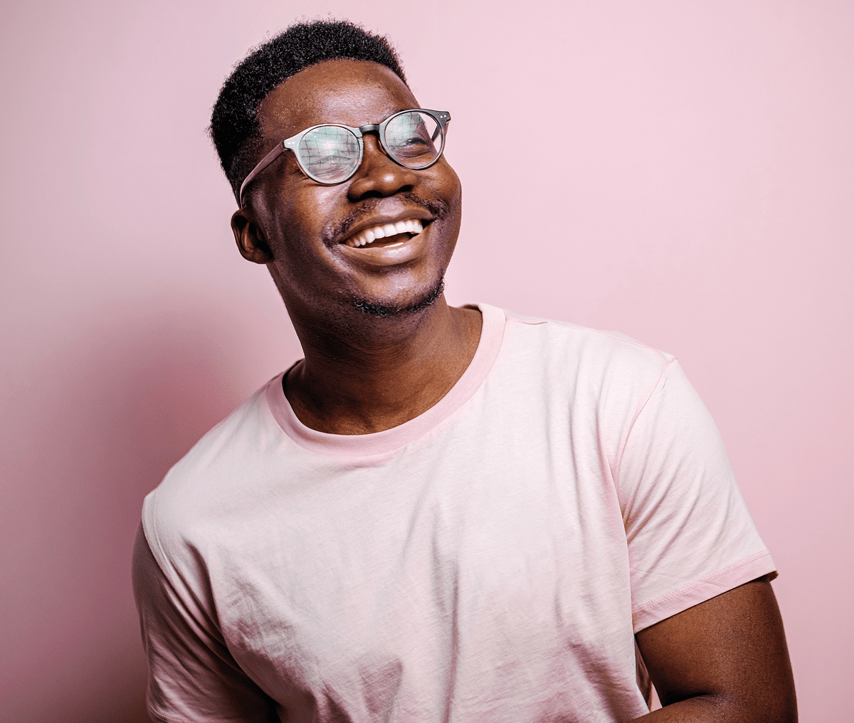 Cheerful man with short hair and glasses