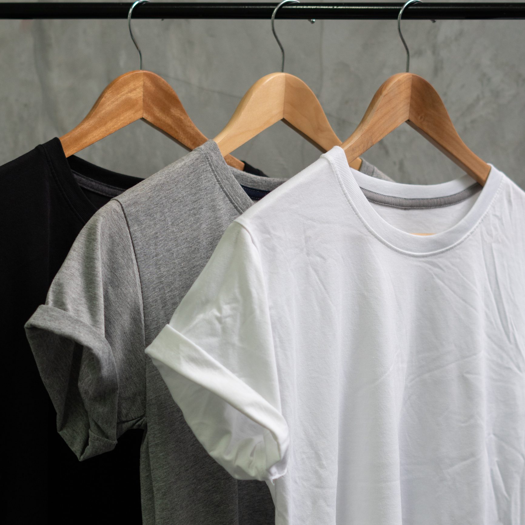Trio of t-shirts hanging neatly