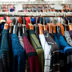 Variety of knitted sweaters hanging